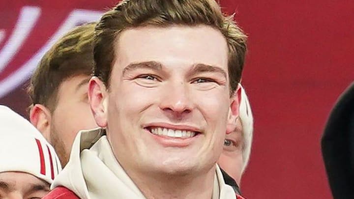 Indiana Hoosiers quarterback Fernando Mendoza (15) holds the Heisman Trophy with Indiana Hoosiers head coach Curt Cignetti on Saturday, Jan. 24, 2026, during the Indiana Football College Football Playoff National Championship celebration and parade at Memorial Stadium in Bloomington. Indiana Hoosiers quarterback Fernando Mendoza (15) holds the Heisman Trophy with Indiana Hoosiers head coach Curt Cignetti on Saturday, Jan. 24, 2026, during the Indiana Football College Football Playoff National Championship celebration and parade at Memorial Stadium in Bloomington.