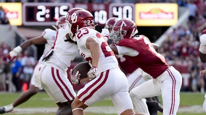 Nov 15, 2025; Tuscaloosa, Alabama, USA; Oklahoma Sooners defensive back Eli Bowen (23) runs a interception back for a touchdown during the first half against the Alabama Crimson Tide at Saban Field at Bryant-Denny Stadium. Mandatory Credit: Gary Cosby-Imagn Images Nov 15, 2025; Tuscaloosa, Alabama, USA; Oklahoma Sooners defensive back Eli Bowen (23) runs a interception back for a touchdown during the first half against the Alabama Crimson Tide at Saban Field at Bryant-Denny Stadium. Mandatory Credit: Gary Cosby-Imagn Images