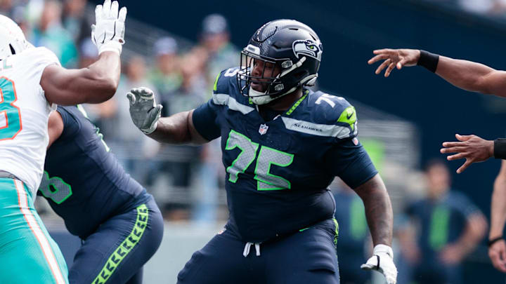 Sep 22, 2024; Seattle, Washington, USA; Seattle Seahawks guard Anthony Bradford blocks during the third quarter against the Miami Dolphins at Lumen Field. Mandatory Credit: Kevin Ng-Imagn Images Sep 22, 2024; Seattle, Washington, USA; Seattle Seahawks guard Anthony Bradford blocks during the third quarter against the Miami Dolphins at Lumen Field. Mandatory Credit: Kevin Ng-Imagn Images