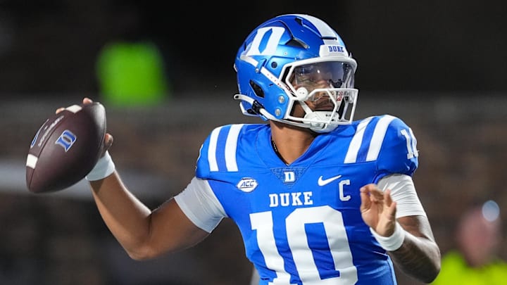 Aug 28, 2025; Durham, North Carolina, USA;  Duke Blue Devils quarterback Darian Mensah (10) goes to throw the ball against the Elon Phoenix during the first half at Wallace Wade Stadium. Mandatory Credit: James Guillory-Imagn Images