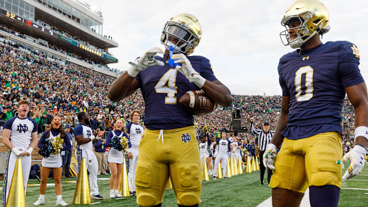Notre Dame running back Jeremiyah Love (4) makes a heart sign after scoring a touchdown in the first half of a NCAA football game against Syracuse at Notre Dame Stadium on Saturday, Nov. 22, 2025, in South Bend. Notre Dame running back Jeremiyah Love (4) makes a heart sign after scoring a touchdown in the first half of a NCAA football game against Syracuse at Notre Dame Stadium on Saturday, Nov. 22, 2025, in South Bend.
