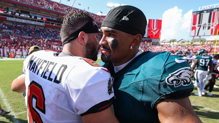 Sep 29, 2024; Tampa, Florida, USA; Philadelphia Eagles quarterback Jalen Hurts (1) greets Tampa Bay Buccaneers quarterback Baker Mayfield (6) after a game at Raymond James Stadium. Mandatory Credit: Nathan Ray Seebeck-Imagn Images