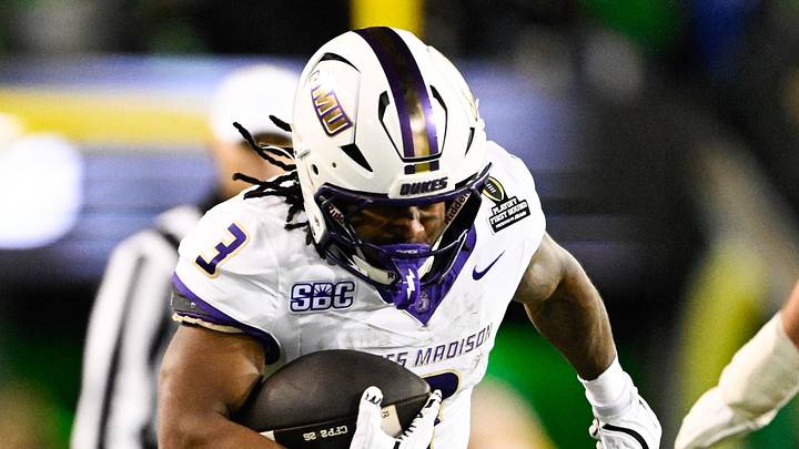 Dec 20, 2025; Eugene, OR, USA; James Madison Dukes running back Wayne Knight (3) rushes as Oregon Ducks defensive back Aaron Flowers (21) defends during the second quarter at Autzen Stadium. Mandatory Credit: Troy Wayrynen-Imagn Images Dec 20, 2025; Eugene, OR, USA; James Madison Dukes running back Wayne Knight (3) rushes as Oregon Ducks defensive back Aaron Flowers (21) defends during the second quarter at Autzen Stadium. Mandatory Credit: Troy Wayrynen-Imagn Images