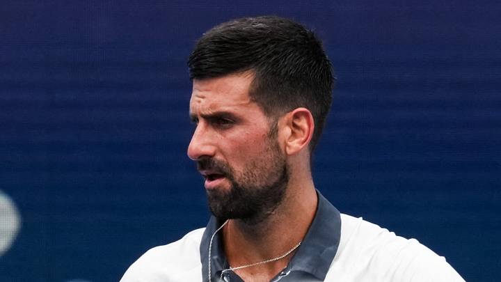 Novak Djokovic reacts after returning a shot Novak Djokovic reacts after returning a shot