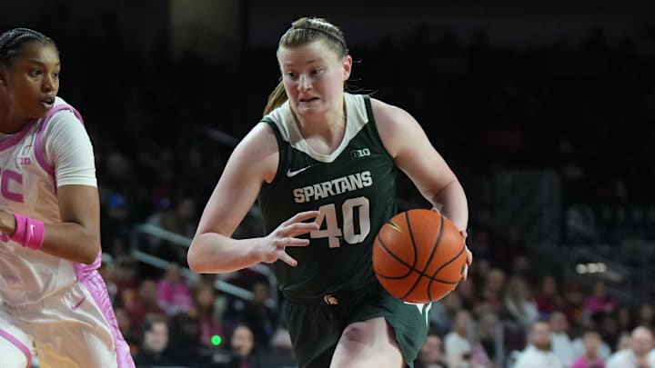 Feb 19, 2025; Los Angeles, California, USA; Michigan State Spartans guard Julia Ayrault (40) dribbles the ball against Southern California Trojans center Rayah Marshall (13) in the second half at the Galen Center. Mandatory Credit: Kirby Lee-Imagn Images