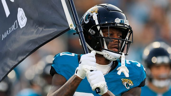 Jacksonville Jaguars cornerback Montaric Brown (30) carries a Jaguars flag onto the field before a preseason NFL football game Saturday, Aug. 17, 2024 at EverBank Stadium in Jacksonville, Fla. The Jacksonville Jaguars defeated the Tampa Bay Buccaneers 20-7. [Corey Perrine/Florida Times-Union]