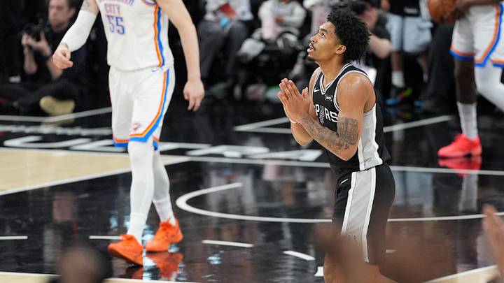 May 28, 2026; San Antonio, Texas, USA; San Antonio Spurs guard Dylan Harper (2) reacts against the Oklahoma City Thunder in the first half during Game 6 of the Western Conference Finals for the 2026 NBA Playoffs at Frost Bank Center.