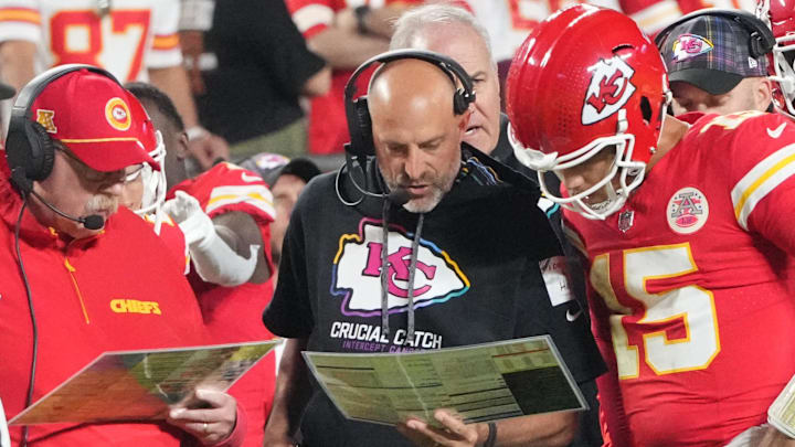 Oct 7, 2024; Kansas City, Missouri, USA; Kansas City Chiefs quarterback Patrick Mahomes (15) looks at plays with offensive coordinator Matt Nagy, center, and head coach Andy Reid against the New Orleans Saints during the first half at GEHA Field at Arrowhead Stadium.