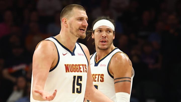 Mar 24, 2026; Phoenix, Arizona, USA; Denver Nuggets center Nikola Jokic (15) and forward Aaron Gordon (32) against the Phoenix Suns at Mortgage Matchup Center. Mandatory Credit: Mark J. Rebilas-Imagn Images