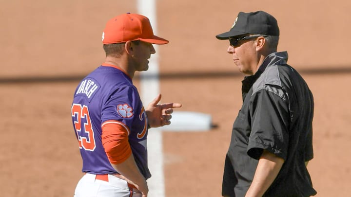 Mar 1, 2025; Greenville, South Carolina, USA; Clemson Tigers head coach Erik Bakich talks to an umpire about a call during the game against the South Carolina Gamecocks during the bottom of the sixth inning at Fluor Field.