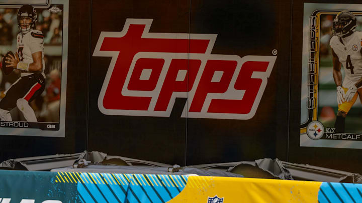 Wednesday, April 22, 2026; The Topps logo is centered next to a CJ Stroud (left) and DK Metcalf (right) trading card inside Acrisure Stadium.