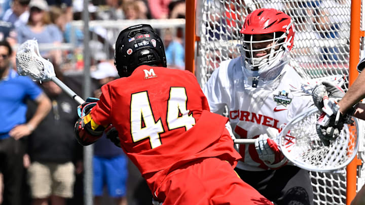May 26, 2025; Foxborough, MA, USA; Maryland midfielder Elijah Stobaugh (44) scores a goal against Cornell goalie Wyatt Knust during the NCAA Men's Lacrosse Championship Final at Gillette Stadium.