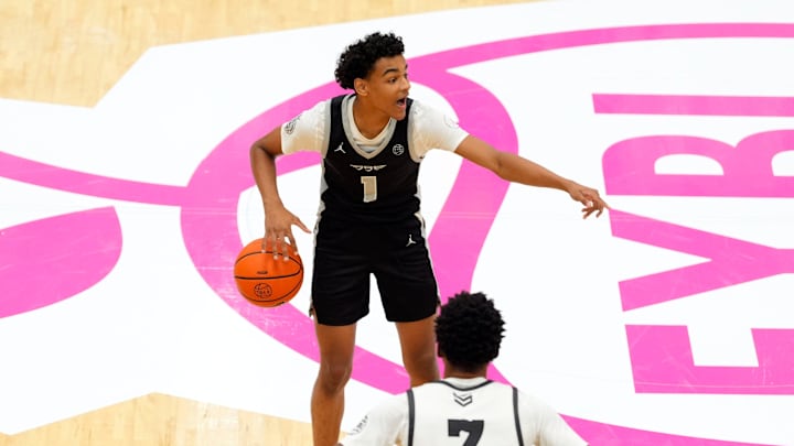 July 19, 2025; North Augusta, South Carolina, USA; Brad Beal Elite Quentin Coleman (1) gestures to a teammate as Team Durant Evans Barning Jr. (7) defends during the Brad Beal Elite and Team Durant game at the Nike EYBL Peach Jam at Riverview Park Activity Center. Brad Beal Elite won 91-59. Mandatory Credit: Katie Goodale - Augusta Chronicle/USA TODAY NETWORK