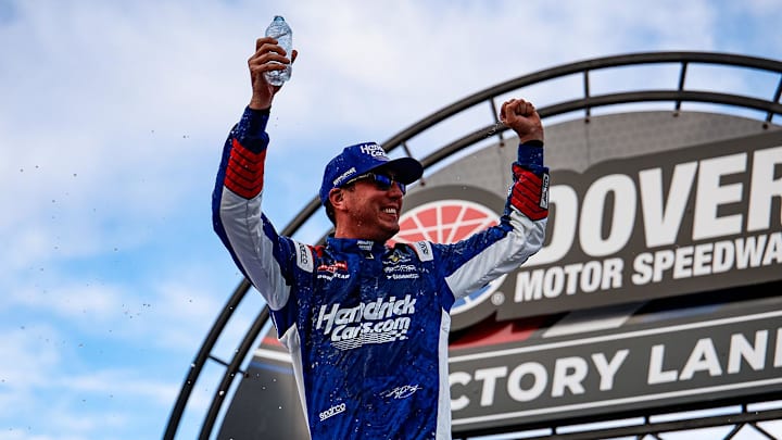 Kyle Busch celebrates in victory lane at Dover Motor Speedway after winning the ECOSAVE 200 NASCAR Craftsman Truck Series race.