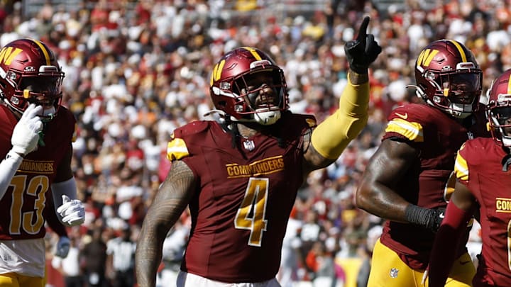 Oct 6, 2024; Landover, Maryland, USA; Washington Commanders linebacker Frankie Luvu (4) celebrates with teammates after recovering a fumble against the Cleveland Browns during the third quarter at NorthWest Stadium. Mandatory Credit: Geoff Burke-Imagn Images