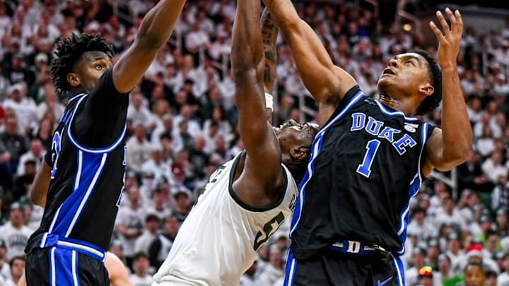 Michigan State's Coen Carr, center, battles Duke's Patrick Ngongba, left, and Caleb Foster for a rebound during the second half on Saturday, Dec. 6, 2025, at the Breslin Center in East Lansing. Michigan State's Coen Carr, center, battles Duke's Patrick Ngongba, left, and Caleb Foster for a rebound during the second half on Saturday, Dec. 6, 2025, at the Breslin Center in East Lansing.