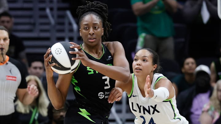 Jun 11, 2025; Seattle, Washington, USA; Seattle Storm forward Nneka Ogwumike (3) looks to pass with Minnesota Lynx forward Napheesa Collier (24) defending during the second half at Climate Pledge Arena. Mandatory Credit: John Froschauer-Imagn Images