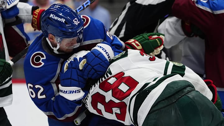 May 5, 2026; Denver, Colorado, USA; Minnesota Wild right wing Ryan Hartman (38) and Colorado Avalanche left wing Artturi Lehkonen (62) fight during the third period in game two of the second round of the 2026 Stanley Cup Playoffs at Ball Arena. Mandatory Credit: Ron Chenoy-Imagn Images