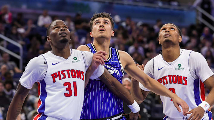 Apr 6, 2026; Orlando, Florida, USA; Detroit Pistons guard Javonte Green (31), guard Ausar Thompson (9) and Orlando Magic forward Tristan da Silva (23) look for the rebound during the second half at Kia Center. Mandatory Credit: Mike Watters-Imagn Images