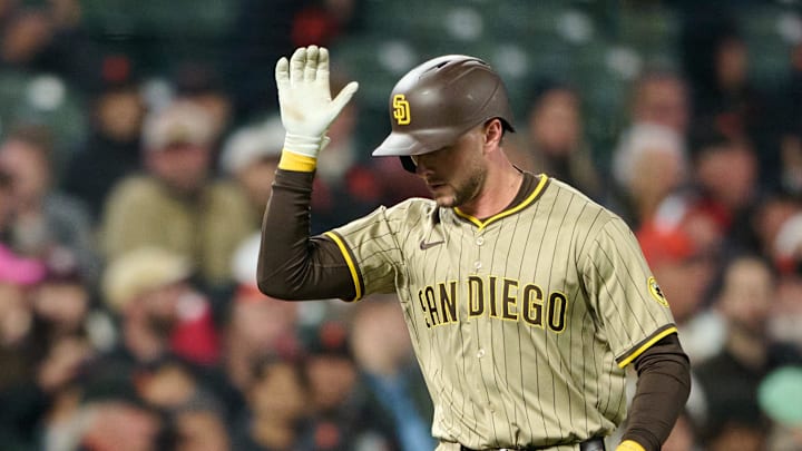 San Diego Padres outfielder Jackson Merrill (3) shakes hands with third base coach Tim Leiper (33) after hitting a one run home run against the San Francisco Giants during the eighth inning at Oracle Park on Aug. 12.