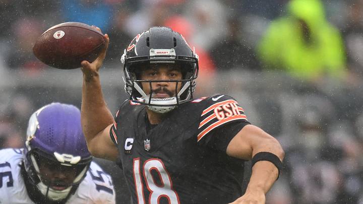 Sep 20, 2026; Chicago, Illinois, USA;  Chicago Bears quarterback Caleb Williams (18) throws a pass while scrambling against Minnesota Vikings linebacker Dallas Turner (15) during the second half at Soldier Field.  Mandatory Credit: Patrick Gorski-Imagn Images
