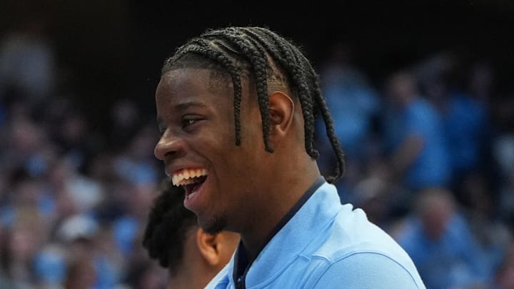 Feb 14, 2026; Chapel Hill, North Carolina, USA; North Carolina Tar Heels guard Isaiah Denis (5) and forward Caleb Wilson (8) react on the bench in the second half at Dean E. Smith Center. Mandatory Credit: Bob Donnan-Imagn Images Feb 14, 2026; Chapel Hill, North Carolina, USA; North Carolina Tar Heels guard Isaiah Denis (5) and forward Caleb Wilson (8) react on the bench in the second half at Dean E. Smith Center. Mandatory Credit: Bob Donnan-Imagn Images