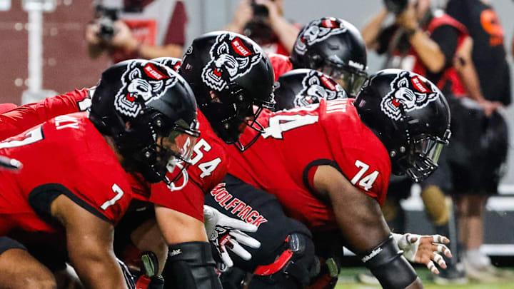 Sep 27, 2025; Raleigh, North Carolina, USA;  North Carolina State Wolfpack offensive lineman Jalen Grant (74) with the ball during the first half of the game against Virginia Tech Hokies at Carter-Finley Stadium. Mandatory Credit: Jaylynn Nash-Imagn Images