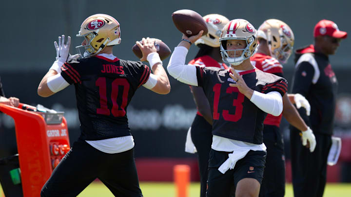 San Francisco 49ers quarterbacks Mac Jones (10) and Brock Purdy (13) work on passing drills San Francisco 49ers quarterbacks Mac Jones (10) and Brock Purdy (13) work on passing drills