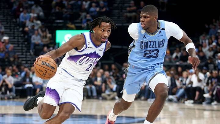 Oct 21, 2026; Memphis, Tennessee, USA; Utah Jazz guard Darryn Peterson (22) drives against Memphis Grizzlies forward Cedric Coward (23) during the fourth quarter at FedExForum. Mandatory Credit: Petre Thomas-Imagn Images Oct 21, 2026; Memphis, Tennessee, USA; Utah Jazz guard Darryn Peterson (22) drives against Memphis Grizzlies forward Cedric Coward (23) during the fourth quarter at FedExForum. Mandatory Credit: Petre Thomas-Imagn Images