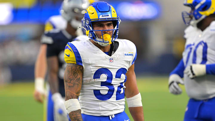 Aug 9, 2025; Inglewood, California, USA;  Los Angeles Rams running back Cody Schrader (32) reacts after a first down during the second half against the Dallas Cowboys at SoFi Stadium. s
