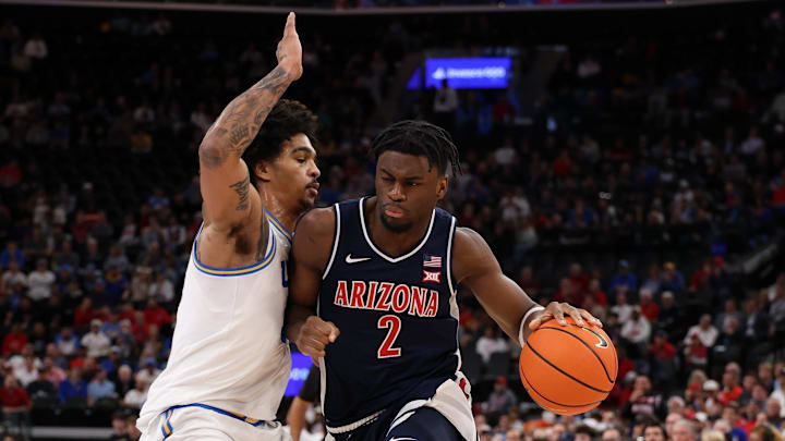 Nov 14, 2025; Inglewood, California, USA;  Arizona Wildcats guard Dwayne Aristode (2) dribbles the ball against UCLA Bruins guard Skyy Clark (55) during the first half of the Hall of Fame Series game at Intuit Dome. Mandatory Credit: Kiyoshi Mio-Imagn Images