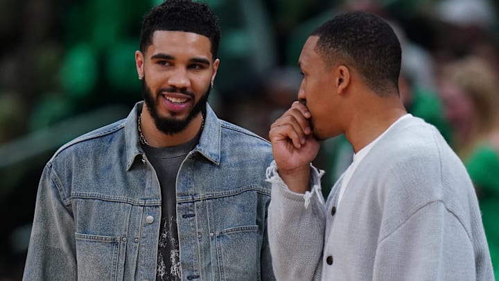 Apr 12, 2024; Boston, Massachusetts, USA; Boston Celtics forward Jayson Tatum (0) talks with former teammate Charlotte Hornets forward Grant Williams (2) in the second half at TD Garden. Mandatory Credit: David Butler II-Imagn Images