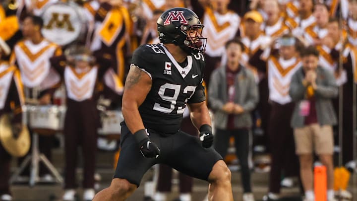 Sep 9, 2023; Minneapolis, Minnesota, USA; Minnesota Golden Gophers defensive lineman Kyler Baugh (93) celebrates after tackling Eastern Michigan Eagles quarterback Austin Smith (4) during the first quarter at Huntington Bank Stadium. Mandatory Credit: Matt Krohn-Imagn Images