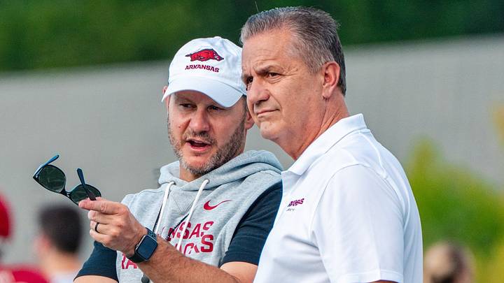 Arkansas Razorbacks football coach Ryan Silvefield speaks with basketball coach John Calipari during practice on Wednesday, Aug. 19. Arkansas Razorbacks football coach Ryan Silvefield speaks with basketball coach John Calipari during practice on Wednesday, Aug. 19.