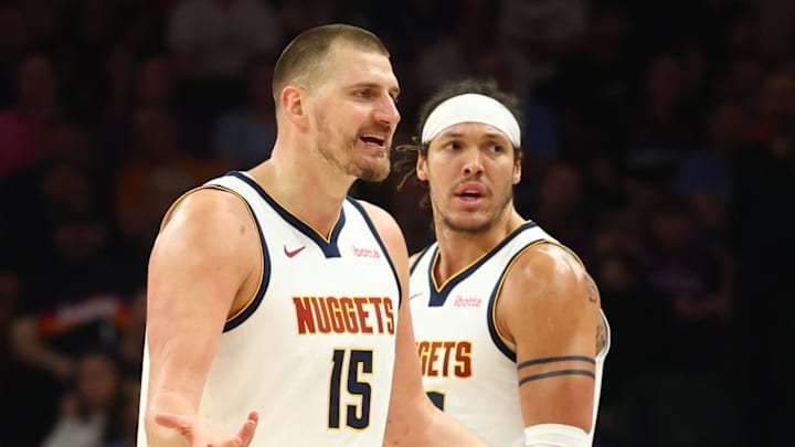 Mar 24, 2026; Phoenix, Arizona, USA; Denver Nuggets center Nikola Jokic (15) and forward Aaron Gordon (32) against the Phoenix Suns at Mortgage Matchup Center. Mandatory Credit: Mark J. Rebilas-Imagn Images