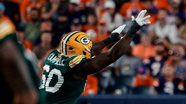 Green Bay Packers defensive tackle Anthony Campbell tries to bat down a pass against Denver. Green Bay Packers defensive tackle Anthony Campbell tries to bat down a pass against Denver.
