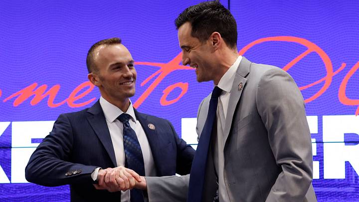 Washington Nationals manager Blake Butera shakes hands with president of baseball operations Paul Toboni