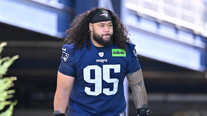 Jul 23, 2025; Foxborough, MA, USA; New England Patriots defensive tackle Khyiris Tonga (95)  walks to the practice field for training camp at Gillette Stadium. Mandatory Credit: Eric Canha-Imagn Images