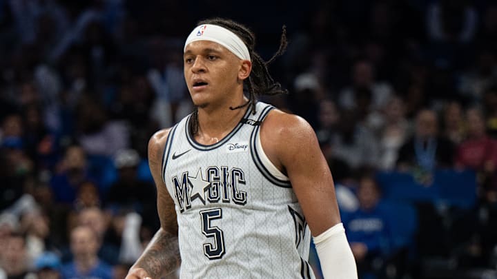 Orlando Magic forward Paolo Banchero (5) dribbles the ball against the Dallas Mavericks in the third quarter at Kia Center. 