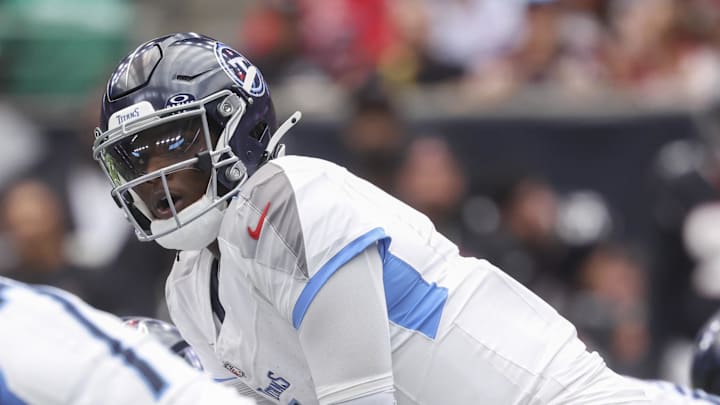 Sep 28, 2025; Houston, Texas, USA; Tennessee Titans quarterback Cam Ward (1) at the line of scrimmage during the fourth quarter against the Houston Texans at NRG Stadium. Mandatory Credit: Troy Taormina-Imagn Images