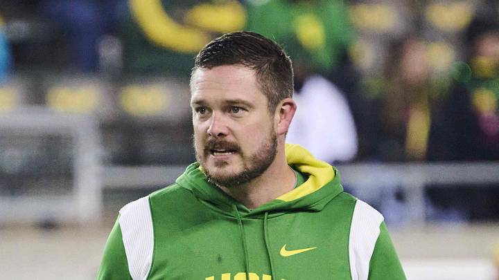 Nov 19, 2022; Eugene, Oregon, USA; Oregon Ducks head coach Dan Lanning watches players warm up before a game against the Utah Utes at Autzen Stadium. Mandatory Credit: Troy Wayrynen-Imagn Images