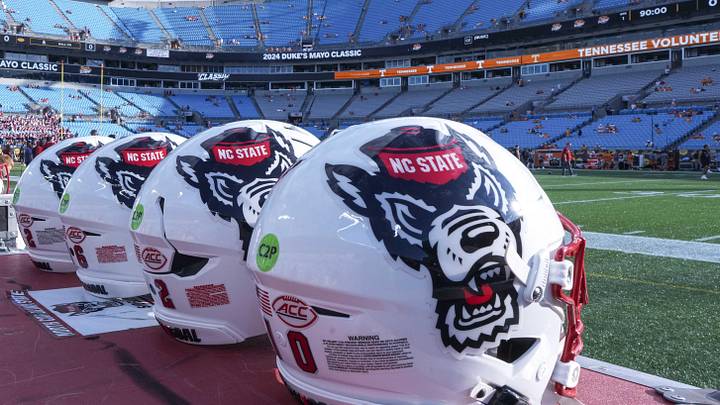 Sep 7, 2024; Charlotte, North Carolina, USA; North Carolina State Wolfpack helmets during pregame activity for the Dukes Mayo Classic against the Tennessee Volunteers at Bank of America Stadium. Mandatory Credit: Jim Dedmon-Imagn Images