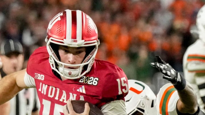 Indiana quarterback Fernando Mendoza (15) rushes into the end zone for a touchdown against Miami during the College Football Playoff national championship game at Hard Rock Stadium in Miami Gardens, Fla., on Jan. 19, 2026.