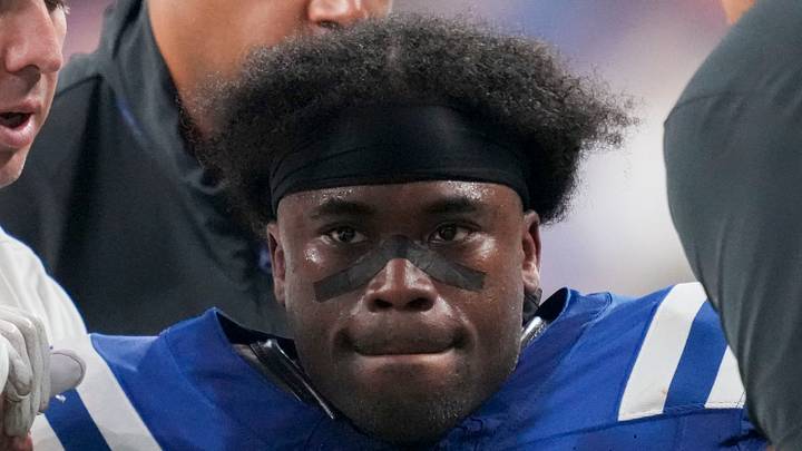 Indianapolis Colts cornerback Kenny Moore II is helped to his feet