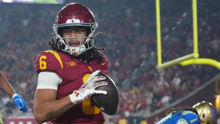 Nov 29, 2025; Los Angeles, California, USA; Southern California Trojans wide receiver Makai Lemon (6) catches a 32-yard touchdown pass against UCLA Bruins defensive back Kanye Clark (1) in the second half at United Airlines Field at Los Angeles Memorial Coliseum. Mandatory Credit: Kirby Lee-Imagn Images Nov 29, 2025; Los Angeles, California, USA; Southern California Trojans wide receiver Makai Lemon (6) catches a 32-yard touchdown pass against UCLA Bruins defensive back Kanye Clark (1) in the second half at United Airlines Field at Los Angeles Memorial Coliseum. Mandatory Credit: Kirby Lee-Imagn Images
