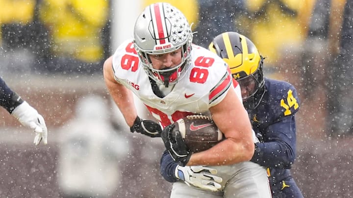 Ohio State tight end Max Klare (86) makes a catch against Michigan defensive back Jordan Young (14) during the second half at Michigan Stadium in Ann Arbor on Saturday, Nov. 29, 2025.