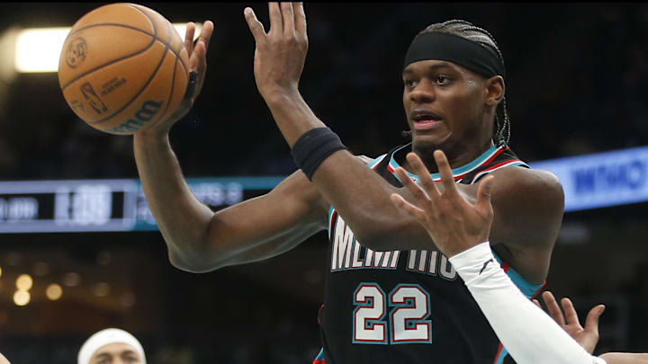 Mar 12, 2026; Memphis, Tennessee, USA; Memphis Grizzlies forward Taylor Hendricks (22) passes the ball as Dallas Mavericks guard Brandon Williams (10) defends during the third quarter at FedExForum. Mandatory Credit: Petre Thomas-Imagn Images