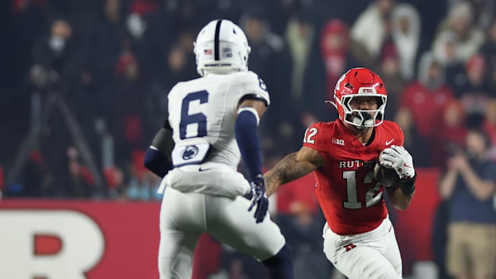 Nov 29, 2025; Piscataway, New Jersey, USA; Rutgers Scarlet Knights tight end Kenny Fletcher Jr. (12) gains yards after catch as Penn State Nittany Lions safety Zakee Wheatley (6) pursues during the second half at SHI Stadium. Mandatory Credit: Vincent Carchietta-Imagn Images