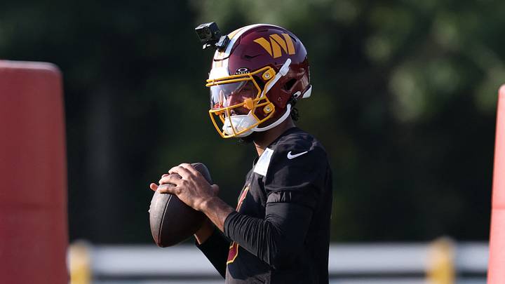 Ashburn, VA, USA; Washington Commanders quarterback Jayden Daniels (5) prepares to pass a ball during a drill during training camp at BigBear.ai Performance Center at Commanders Park. Mandatory Credit: Geoff Burke-Imagn Images Ashburn, VA, USA; Washington Commanders quarterback Jayden Daniels (5) prepares to pass a ball during a drill during training camp at BigBear.ai Performance Center at Commanders Park. Mandatory Credit: Geoff Burke-Imagn Images