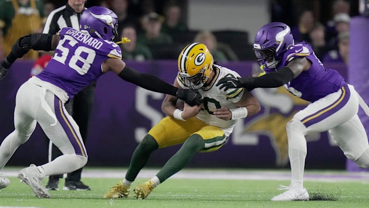 Green Bay Packers quarterback Jordan Love (10) is sacked by Minnesota Vikings linebacker Jonathan Greenard.